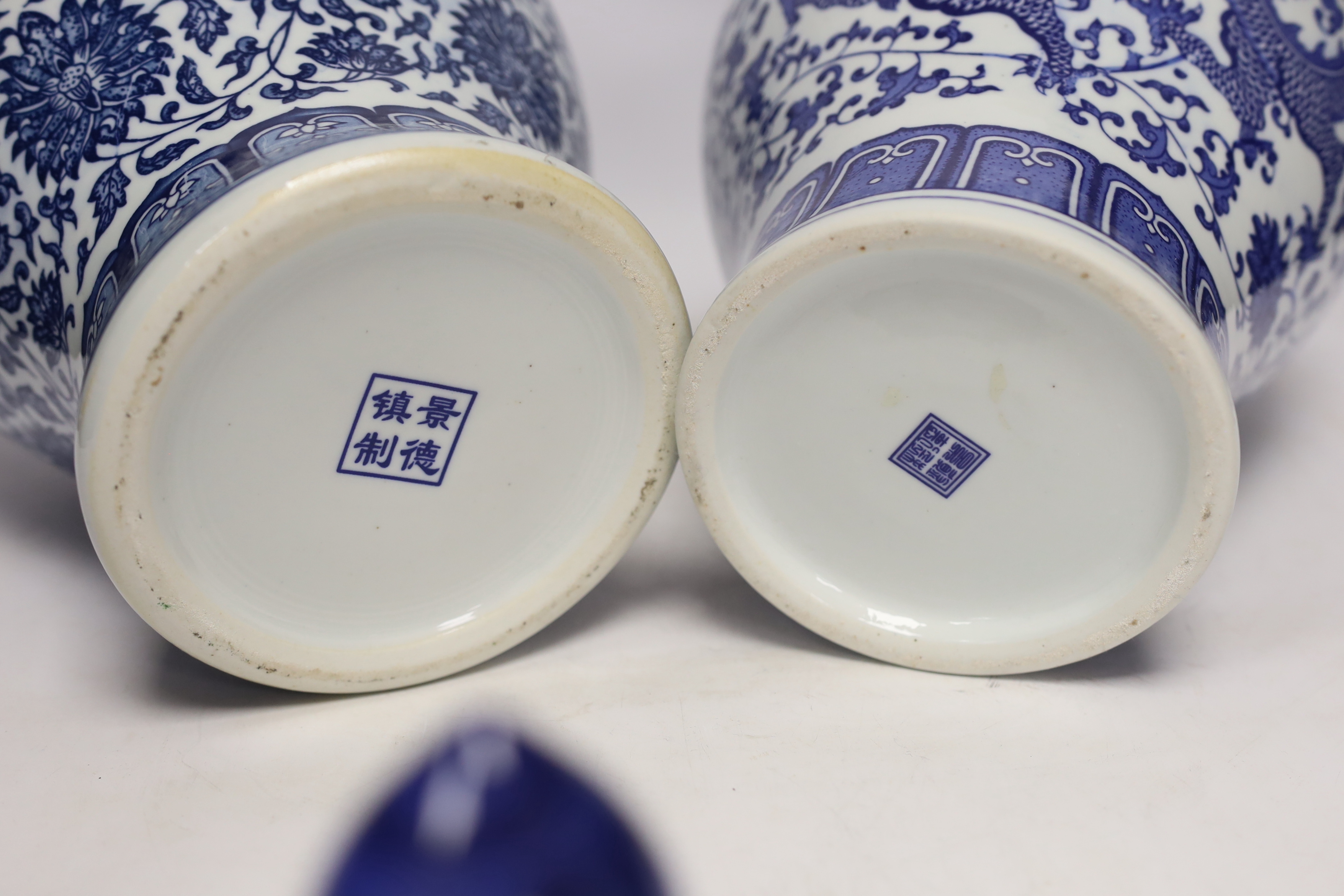 Two Chinese blue and white vases and covers, 38cm high